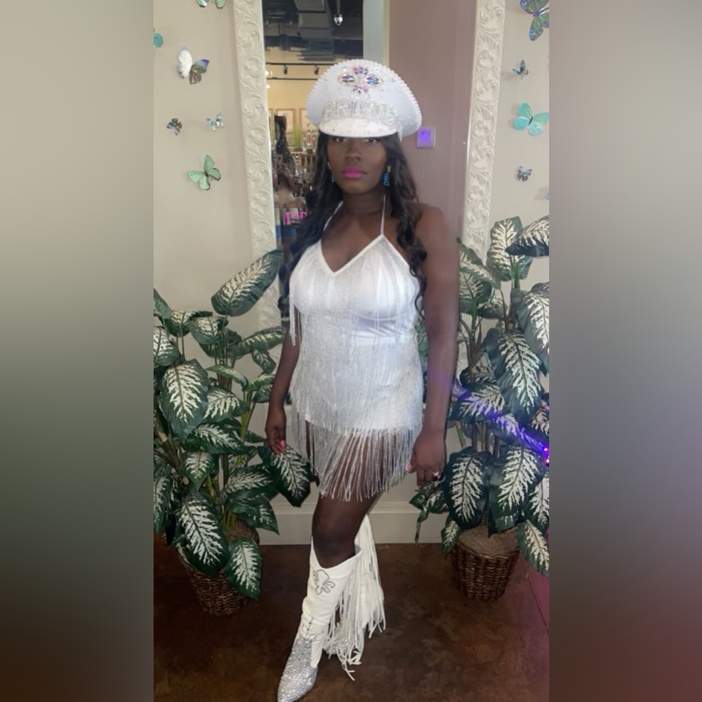 A white two piece fringe set. Worn once for about 3 hours